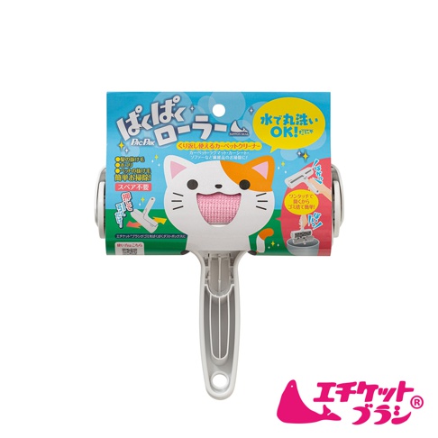 可水洗免耗材清潔滾輪，主體為白色貓咪造型，粉色絨毛滾輪，搭配藍色與黃色印刷紙盒包裝，紙盒上有日文說明及貓咪圖案。