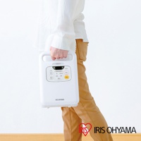 白色IRIS OHYAMA雙筒強力烘被機，白色主機，設有黑色和黃色按鈕的控制面板，手柄上有連接的白色軟管。