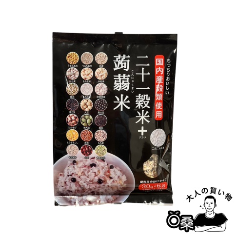 黑底包裝，印有「二十一穀米+OHARA蒟蒻米」字樣，左側有數個小圓形圖示，顯示多種穀物和豆類，下方有一碗混合了多種穀物的米飯，右側有「國內產穀類使用」等日文標示。
