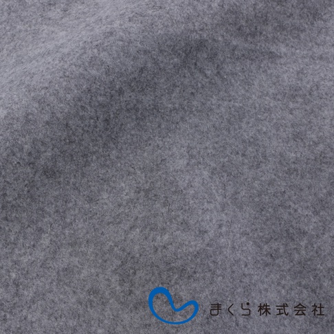 單人備長炭防潮床墊的近拍，材質為深灰色絨布，表面有細微紋理，右下角有藍色曲線圖標和日文字樣。