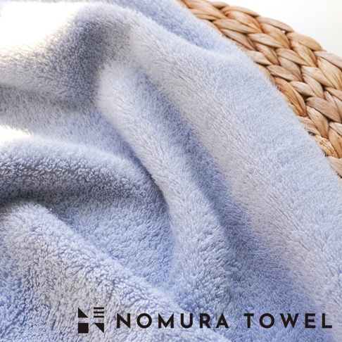 野村毛巾 logo 下方是 NOMURA TOWEL 文字。