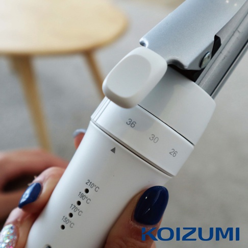 手持白色電棒捲，顯示溫度設定210°C、190°C、170°C、150°C，以及捲筒直徑36、30、26。