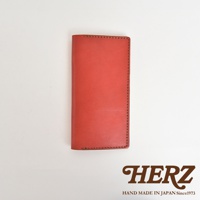 職人手作皮革旅行記事本書套，採用橘紅色皮革，邊緣有精緻的縫線裝飾。