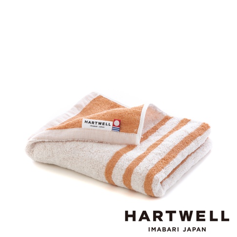 橘色條紋今治薄毛巾，一角帶有Hartwell Imabari Japan 品牌標籤。