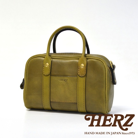 日本HERZ手工製作的綠色皮革迷你波士頓包，配有雙提把和可拆卸肩帶