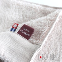 粉色今治毛巾，標有 WATA TSUBOOMI 字樣，右下角有日本桃雪商標。