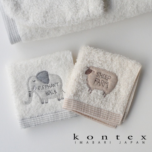 今治純棉手帕，左為灰色大象圖案，右為米色羊圖案，皆有細緻條紋裝飾，材質柔軟。