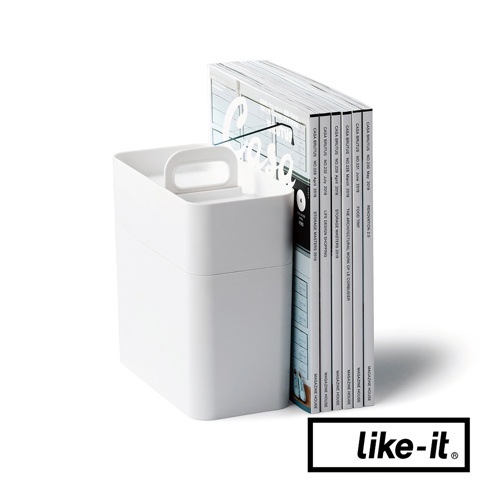 白色手提式雙層化妝品收納箱，帶有提把，旁邊擺放著一本雜誌。