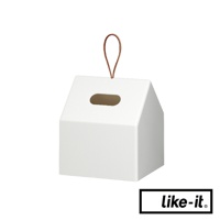 白色小屋形衛生紙盒，頂部有皮質提把，側面有一個長方形開口。