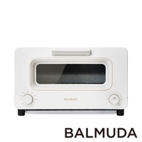 The Toaster 蒸氣烤麵包機，白色，具有簡約設計，配備一個可視窗、溫度選擇旋鈕和定時器旋鈕，機身為光滑的白色材質。