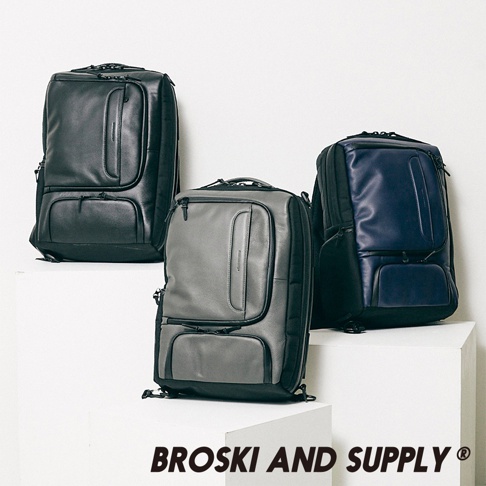 三款防水真皮革兩用手提後背包，分別為黑色、灰色和海軍藍。背包設計簡潔，有正面拉鍊口袋和翻蓋口袋，材質光滑有質感。