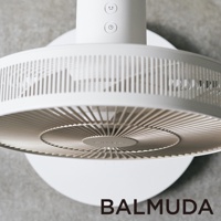 The GreenFan 風扇，白X金限量色，圓形白色機身，金色扇葉，簡約設計，帶有兩個功能按鈕， mounted on a wall.