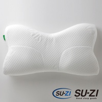 白色 AS 快眠止鼾枕，表面有細小網格紋理，枕面中央凹陷，兩側隆起，呈現人體工學設計。枕頭左側有一個綠色小標籤。