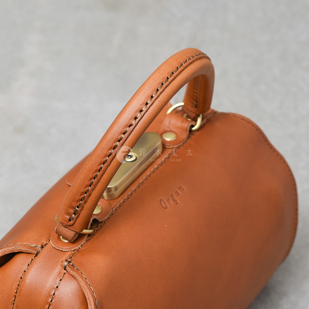 職人手作皮革Organ兩用口金手提包，展示棕色皮革包身、提把及金色金屬扣環，包面上壓印有「Organ」字樣。