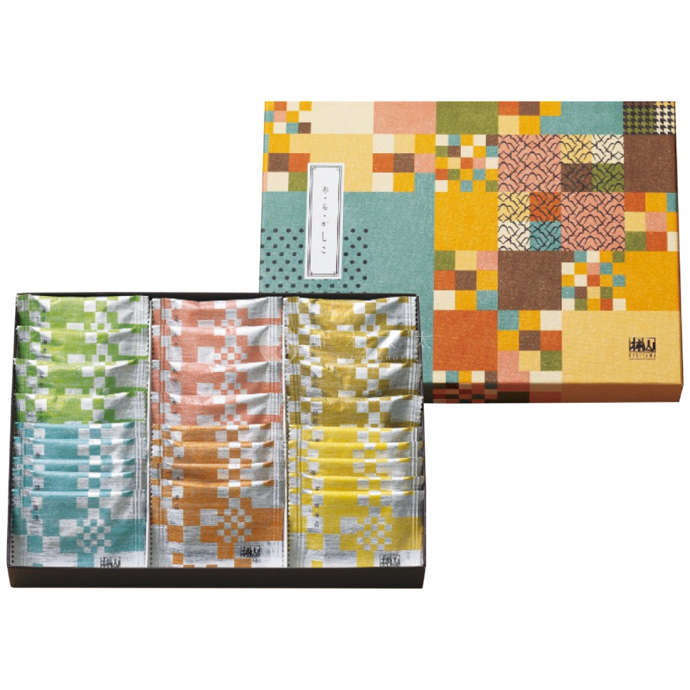 精緻的禮盒包裝，右上方盒蓋印有色彩繽紛的幾何格子圖案與日式紋樣，左下方則開展展示內部排列整齊的包裝袋，分為綠色、藍色、粉橘色、深橘色與黃色共五種顏色，每個包裝袋表面皆帶有銀色方格狀紋理，整體呈現典雅的日式伴手禮盒風格。