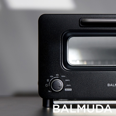 The Toaster Pro 蒸氣烤麵包機專業版 K11C-SE，黑色霧面機身，設有圓形旋鈕和玻璃觀察窗，可調節溫度與時間。