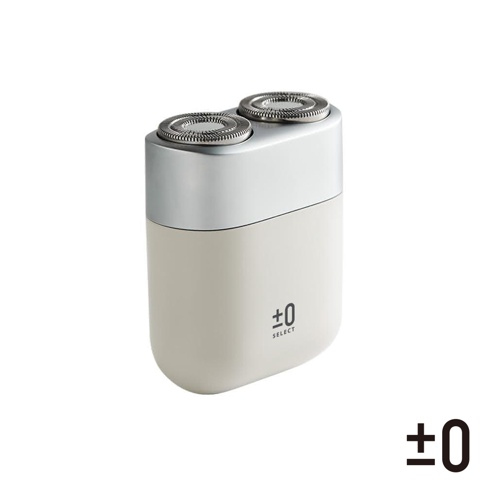 CCS-J010 便攜刮鬍刀，上半部為銀色金屬材質，下半部為淺米色塑料機身，頂部有兩個圓形刀網，機身側面印有「±0 SELECT」字樣。