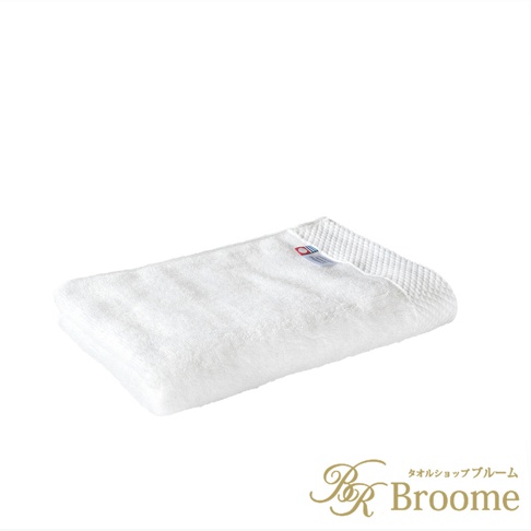 今治純棉長毛巾，白色，表面有細緻的菱紋織法，質地柔軟，附有品牌標籤。