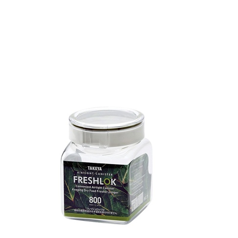 一個透明塑膠製成的角型密封收納罐，容量標示為 800ML，配有淺灰色蓋子和密封圈。罐身上貼有綠葉圖案的標籤，標示著「TAKΕYA FRESHLOK AIRTIGHT CANISTER」。