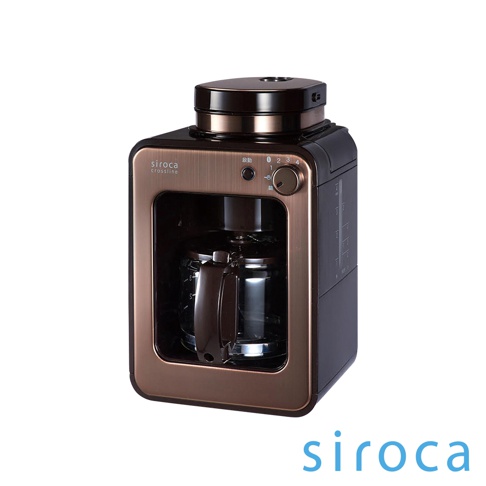 銅色與黑色相間的 SC-A1210 自動研磨咖啡機，設有玻璃咖啡壺、操作按鈕及旋鈕，頂部有研磨器蓋。