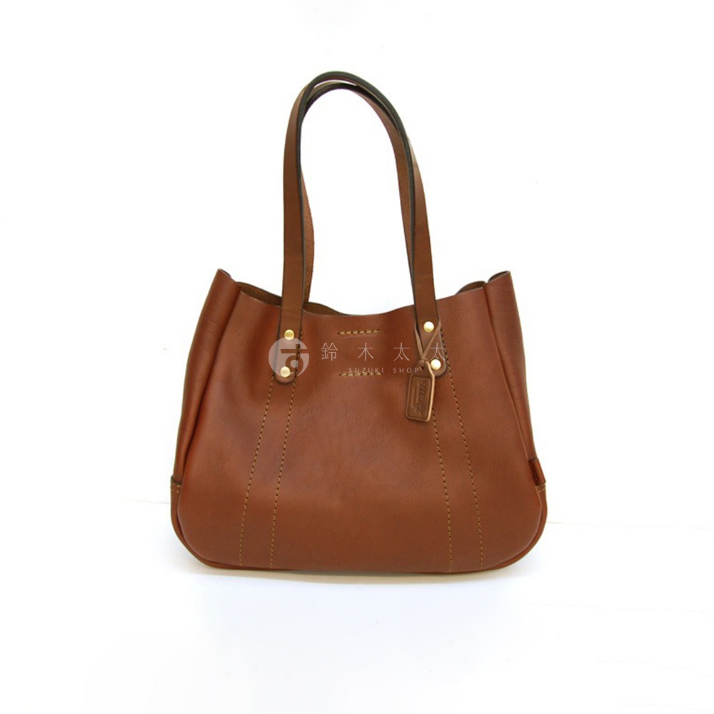 職人手作皮革仕女托特包 T-10，咖啡色，採用光滑皮革製作，包身線條柔和，配有兩條手提帶，包包正面飾有縫線細節及品牌標籤。