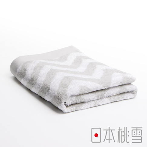 今治北歐浴巾，淺灰色與白色交織的鋸齒狀紋理，柔軟棉質，對折擺放。