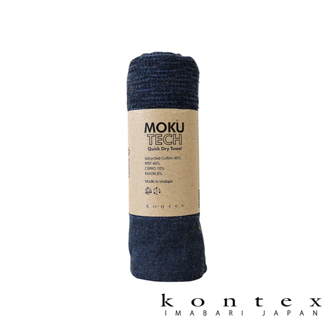MOKU TECH 超速乾輕薄吸水長毛巾，深藍色，材質包含再生棉、RPET、CUPRO、嫘縈，印有品牌資訊與成分標示，日本製。