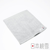 一條淺灰色今治超長棉方巾，表面柔軟，帶有細緻的菱格紋邊緣，右下角有品牌標籤，標籤上印有「huarte」字樣及日式圖案。