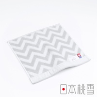 今治北歐方巾，灰色與白色相間的鋸齒形圖案，材質為柔軟的棉，帶有品牌標籤。