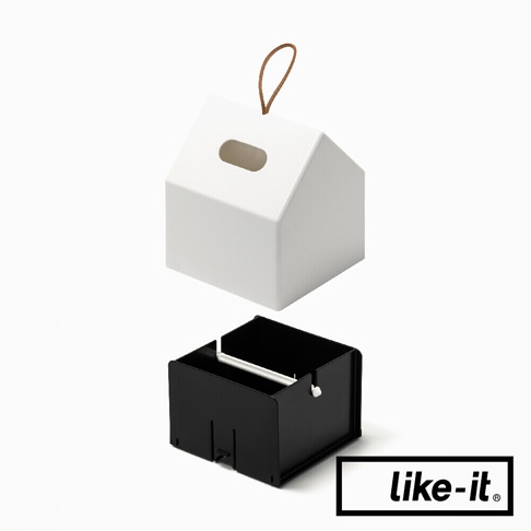 白色小屋形衛生紙盒，頂部有皮繩吊掛，側邊有長方形開口。下方為黑色方形內盒，用於放置衛生紙。