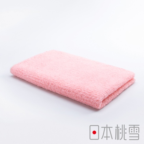 粉紅色今治細絨毛巾，材質柔軟，表面有細緻的絨毛紋理，呈現溫暖的質感。