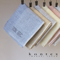 MOKU LINEN 輕薄速乾棉麻拭巾，呈現多種柔和色彩，包括淺藍、米白、淺黃、粉紅及灰色。拭巾表面織紋清晰，材質為棉麻混紡，印有品牌標誌與產地資訊。