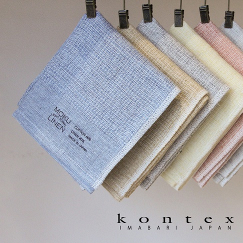 MOKU LINEN 輕薄速乾棉麻拭巾，呈現多種柔和色彩，包括淺藍、米白、淺黃、粉紅及灰色。拭巾表面織紋清晰，材質為棉麻混紡，印有品牌標誌與產地資訊。