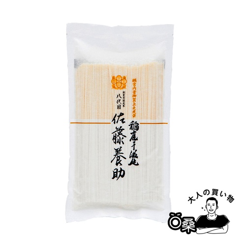 一包白色包裝的無選別稻庭烏龍麵，內含多束細長、淺黃色的麵條，包裝上有日文標示與品牌圖案。