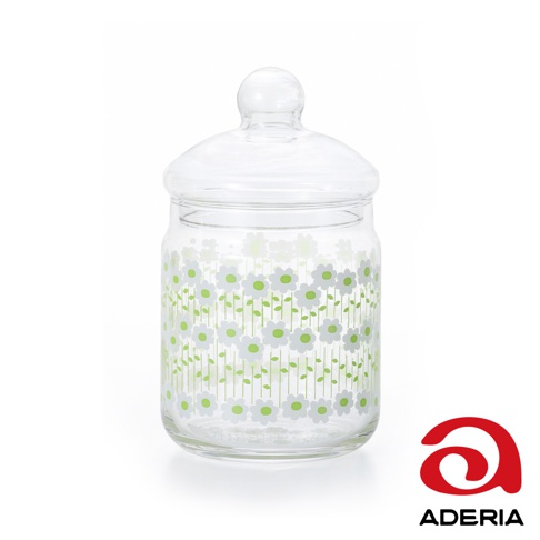 昭和復古玻璃儲物罐，透明玻璃材質，瓶身印有細緻的白色小花和綠色花莖圖案，配有圓形玻璃蓋。