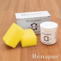 Renapur 皮革保養組，包含一罐白色瓶身的皮革保養油，以及兩個黃色海綿。