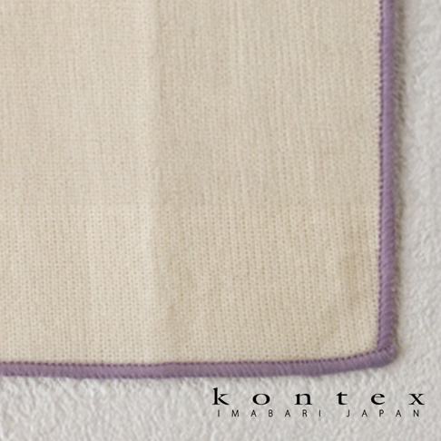 一張淺米色材質細緻的 KONTEX 今治和紙有機棉廚房拭巾，邊緣縫製著淡紫色的包邊，呈現簡約的日系質感，下方印有 KONTEX IMABARI JAPAN 的品牌標誌。
