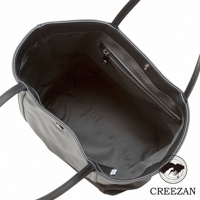 JETTER 大容量黑色皮革肩背托特包，內部為黑色內襯，設有拉鍊暗袋及磁釦設計。