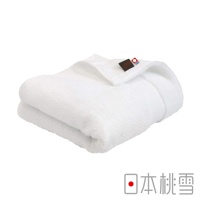 白色今治匹馬棉浴巾，質地柔軟，有精緻的品牌標籤。
