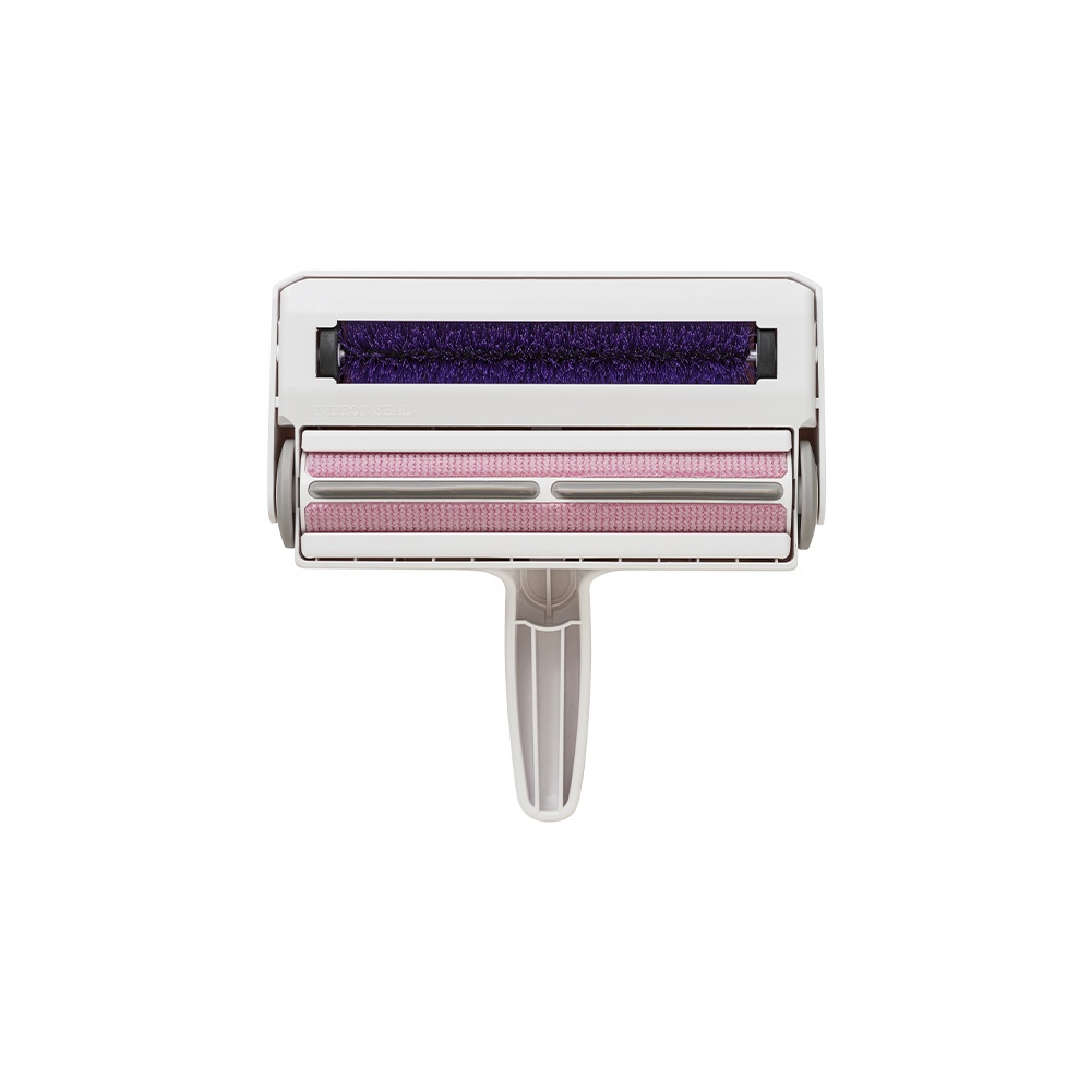 白色塑膠機身，頂部設有紫色刷毛滾輪，下方為兩層粉色網狀材質滾輪，整體呈水平放置。