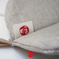 Tricot 棉麻防燙鍋套，淺米色，織紋清晰，帶有紅色「福」字標誌。