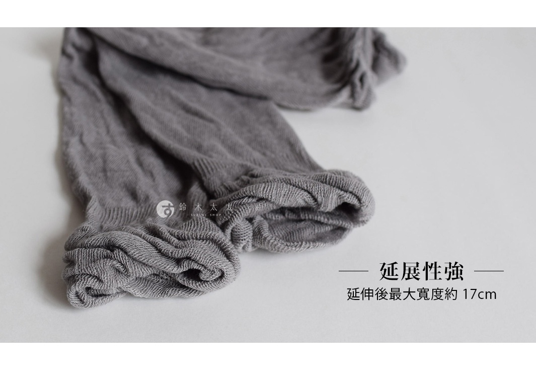 灰色棉麻混紡袖套，材質柔軟，有彈性，袖口處有羅紋設計。