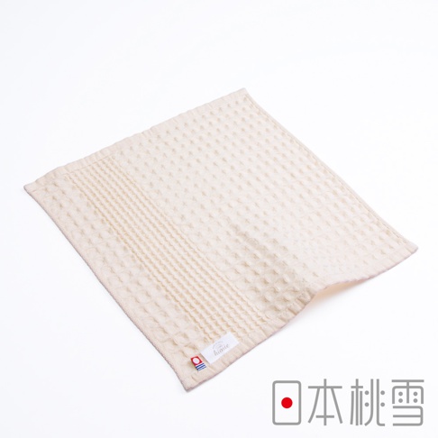 米色今治鬆餅方巾，織有格子紋理，一側有條紋裝飾，角落有品牌標籤。