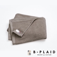 EVE 今治強韌薄手鱗紋浴巾，顏色為灰色，材質為棉，表面有細緻的鱗紋織紋，邊緣有同色系滾邊，並附有品牌標籤。