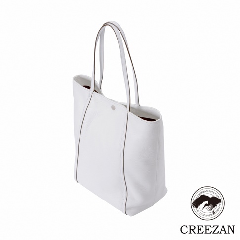 JETTER 大容量白色皮革肩背托特包 CJTE-025，具有簡潔的設計和對比色的滾邊，搭配雙提把和單一銀色鈕扣開合。