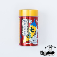 紅色金頂的罐裝唐辛子七味粉，罐身印有黃色七味辣椒圖案，並有日文標示「七味ごま」、「信州善光寺大門町」等字樣。