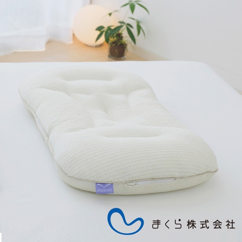 白色網格紋理調節枕，表面有凹凸紋路設計，側面有拉鍊，附有紫色標籤，標有「liyum」字樣。