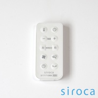 白色塑膠遙控器，上方有溫度、電源、風量增減、擺頭設定（左、右）、風扇模式、自然風模式、定時及睡眠模式等按鈕，印有「siroca SF-T1710RM 風扇」字樣。