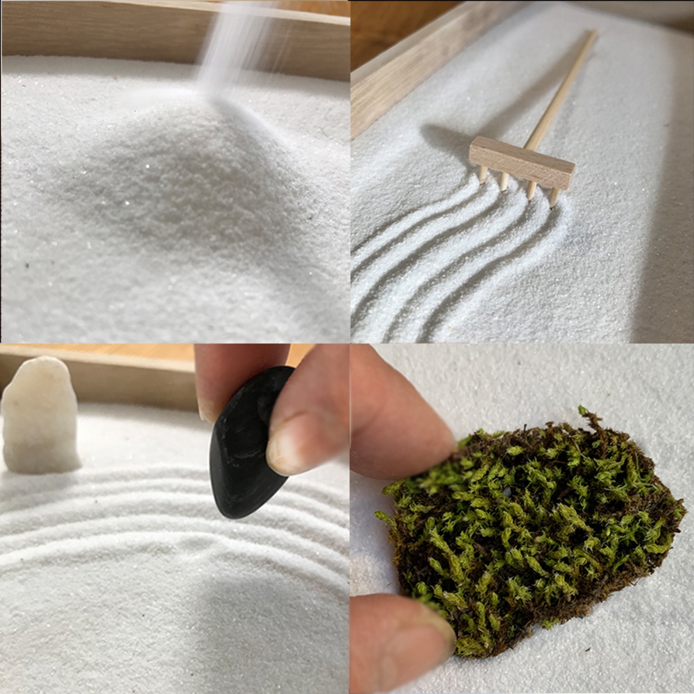 日本枯山水模型，包含細膩的白色細沙、木製耙子、黑色鵝卵石、白色小石塊及一塊青苔。