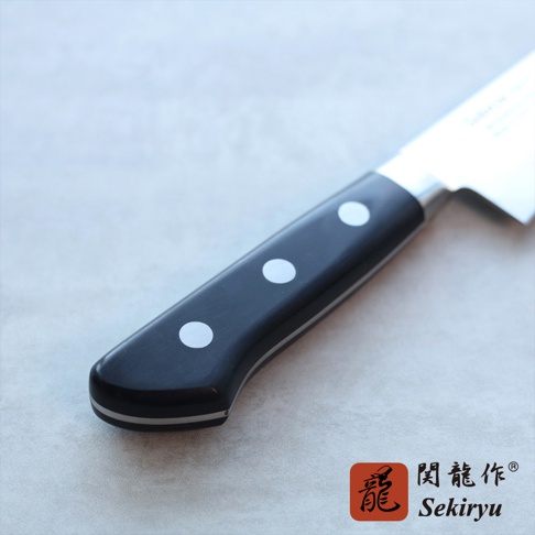 鉬釩不鏽鋼骨刻刀，刀柄為黑色，帶有三個圓形白色鉚釘，刀身部分露出，為不鏽鋼材質。